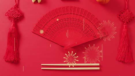 Animation-of-chinese-pattern-and-fan-decoration-on-red-background