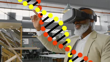 Animation-of-dna-structure-spinning-over-african-american-businessman-wearing-vr-headset-at-office