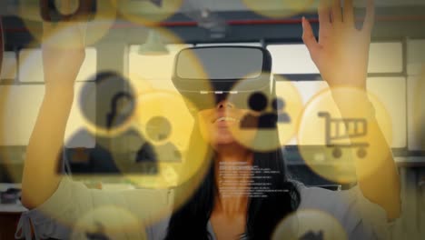 Animation-of-digital-icons-and-data-processing-over-biracial-woman-wearing-vr-headset-at-office