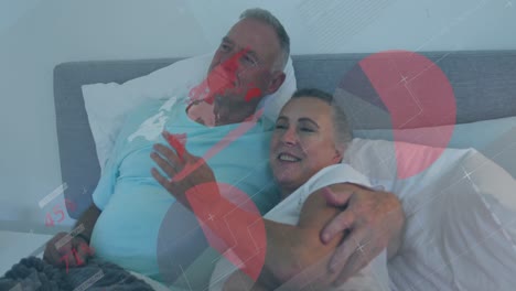 Animation-of-statistical-data-processing-over-r-caucasian-senior-couple-lying-in-the-bed-together