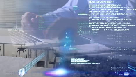 Animation-of-data-processing-over-mid-section-of-man-using-laptop-against-aerial-view-of-cityscape
