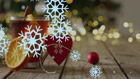 Animation-of-snow-falling-over-christmas-drink-and-decorations