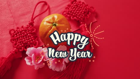Animation-of-new-year-greetings-text-over-chinese-traditional-decorations-on-red-background