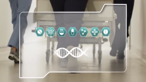 Animation-of-dna-strand-and-icons-over-diverse-doctors-at-hospital