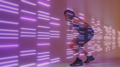 Animation-of-neon-pattern-and-biracial-basketball-player