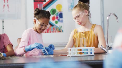 Diverse-happy-schoolchildren-having-science-class-in-school-lab