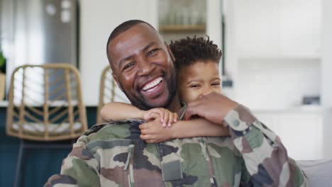 Portrait-of-happy-african-american-father-and-his-son-embracing