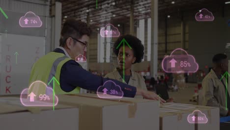 Animation-of-digital-clouds-and-data-processing-over-diverse-people-working-in-warehouse