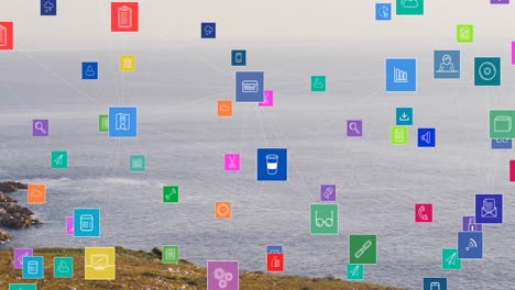 Animation-of-social-media-icons-over-shore-and-sea-landscape