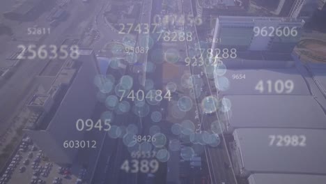 Animation-of-icons-forming-globe-and-increasing-numbers-over-aerial-view-of-city