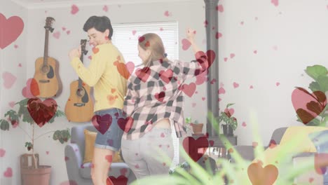 Animation-Von-Herz-Emojis-über-Einem-Glücklichen,-Verliebten-Kaukasischen-Frauenpaar