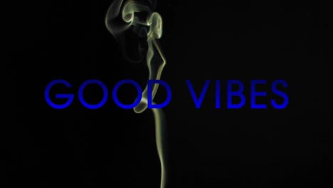 Animation-of-good-vibes-text-over-smoke-on-black-background