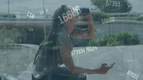 Animation-of-data-processing-over-african-american-woman-using-smartphone