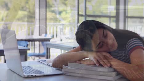Animation-of-financial-data-processing-over-biracial-schoolgirl-sleeping-by-laptop-in-class
