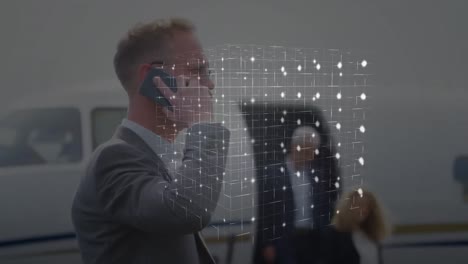 Animation-of-network-of-connections-over-caucasian-businessman-using-smartphone
