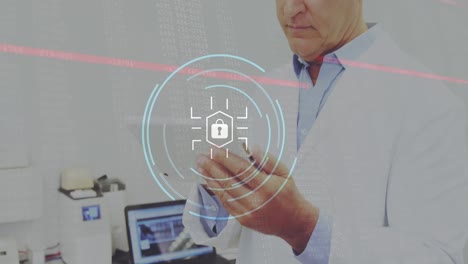 Animation-of-security-padlock-icon-over-caucasian-senior-male-doctor-using-digital-tablet