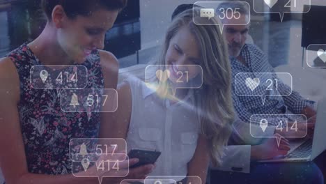 Animation-of-social-media-icons-with-numbers-over-diverse-people-using-smartphone