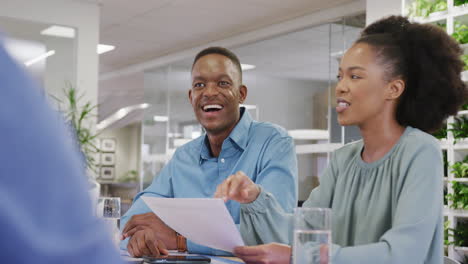 Happy-diverse-business-people-discussing-work-at-office,-slow-motion