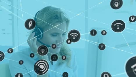 Animation-of-network-of-connections-with-icons-over-caucasian-businesswoman-using-phone-headphones