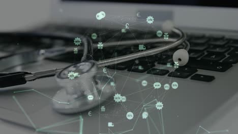 Animation-of-network-of-connections-with-icons-over-stethoscope-and-laptop