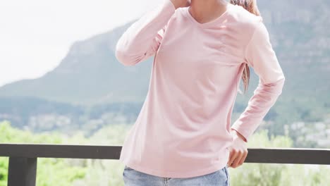 Slow-motion-video-of-biracial-woman-wearing-pink-long-sleeve-shirt-with-copy-space