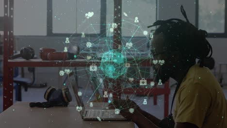 Animation-of-network-of-connections-with-icons-over-african-american-businessman-using-laptop