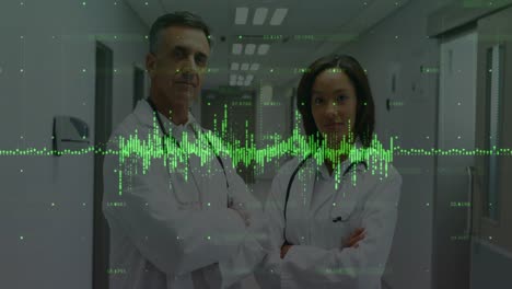 Animation-of-data-processing-over-diverse-male-and-female-doctors-standing-together-at-hospital