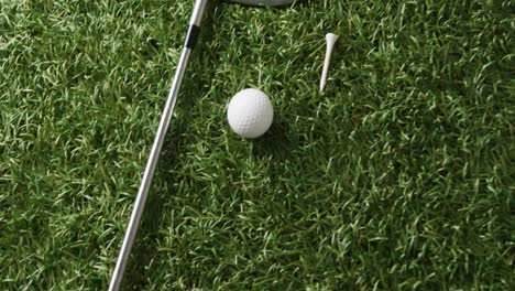 Close-up-of-golf-club-and-ball-on-grass,-copy-space,-slow-motion