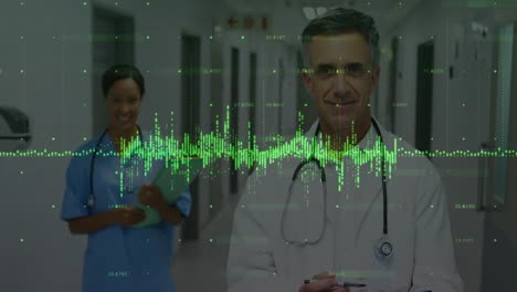 Animation-of-data-processing-over-diverse-male-doctor-and-female-health-worker-smiling-at-hospital