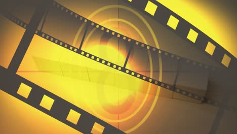 Animation-of-film-tape-and-countdown-on-yellow-background