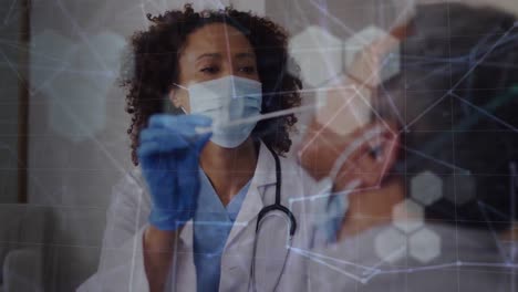 Animation-of-shapes-and-connections-over-diverse-doctor-and-patient-taking-swab-test