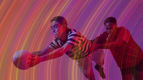 Animation-of-light-trails-over-female-rugby-players-on-neon-background