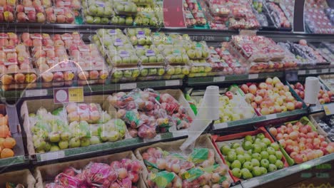 Animation-of-stock-market-data-processing-against-fresh-fruits-on-the-shelves-at-a-grocery-store