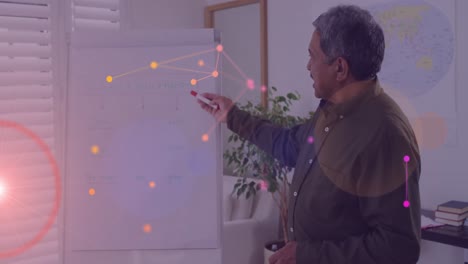 Animation-of-network-of-connections-over-biracial-male-teacher-pointing-at-whiteboard
