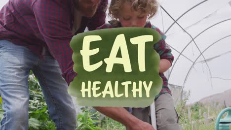 Animation-of-eat-healthy-text-banner-over-caucasian-male-farmer-teaching-his-son-to-farm