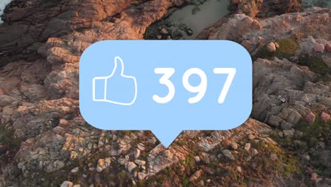 Animation-of-thumbs-up-social-media-people-icon-and-numbers-over-landscape