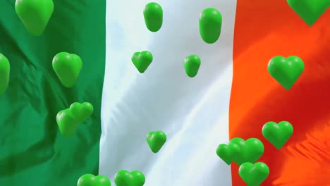 Animation-of-st-patrick's-day-green-hearts-on-irish-flag-background