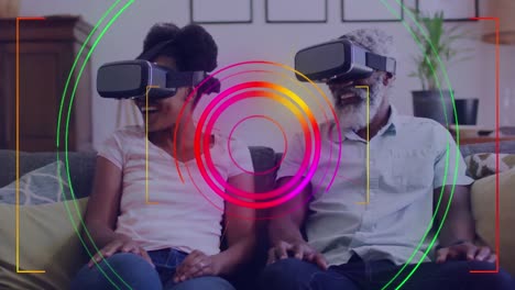 Animation-of-data-processing-with-scope-over-african-american-man-and-woman-using-vr-headsets