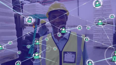 Animation-of-network-of-profile-icons-against-african-american-male-worker-smiling-at-warehouse