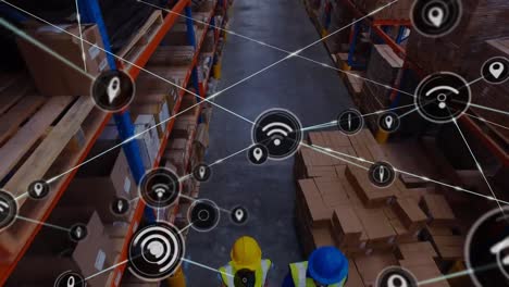 Animation-of-network-of-connections-with-icons-over-african-american-man-working-in-warehouse
