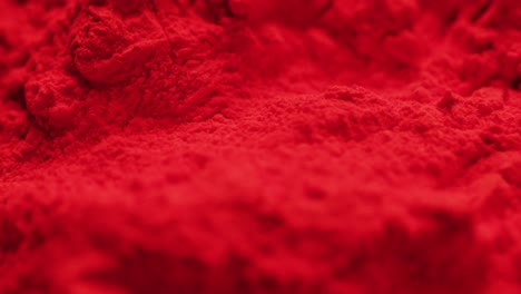 Video-of-close-up-of-red-powder-with-copy-space