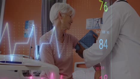 Animation-of-cardiograph-over-diverse-doctor-and-patient-at-hospital