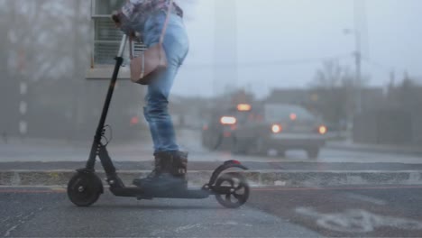 Animation-of-cars-over-biracial-woman-using-scooter-on-street