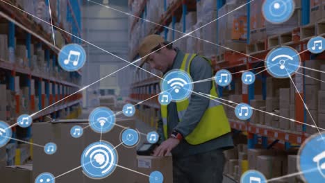 Animation-of-network-of-digital-icons-over-caucasian-male-worker-checking-stock-at-warehouse