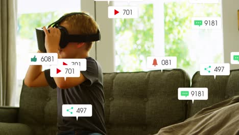 Animation-Von-Social-Media-Symbolen-Mit-Zahlen-über-Einem-Kaukasischen-Jungen,-Der-Ein-VR-Headset-Verwendet