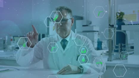 Animation-of-icon-in-hexagons-over-senior-caucasian-scientist-swiping-on-futuristic-screen-in-lab