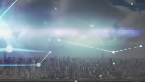 Animation-of-glowing-network-of-connections-and-light-trail-against-aerial-view-of-cityscape