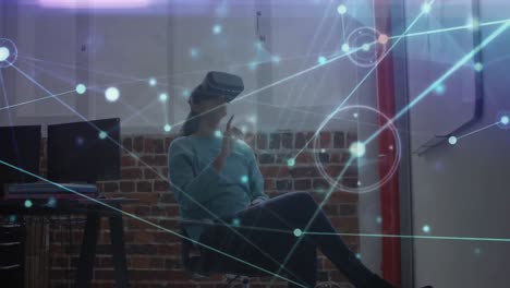 Animation-of-network-of-connections-over-biracial-businesswoman-wearing-vr-headset