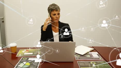 Animation-of-network-of-profile-icons-over-caucasian-businesswoman-talking-on-smartphone-at-office