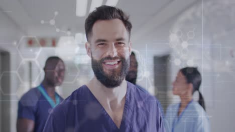 Animation-of-medical-data-over-portrait-of-smiling-bearded-male-doctor-in-hospital-corridor